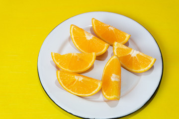 Naklejka na ściany i meble Orange slices on colorful background