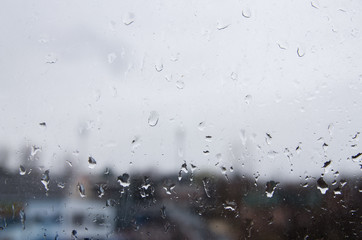 view on the street through the rainy window