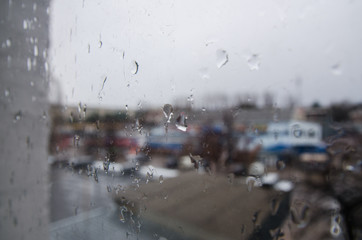 view on the street through the rainy window