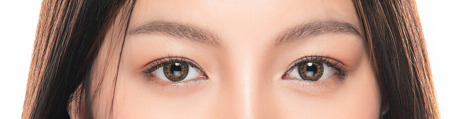 Close-up Asian Women's eyes on White Blackground. - obrazy, fototapety, plakaty