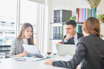 CEO or chief financial officer sees financial summary reports with his secretary team or discusses goal future project business plan about future growth and improvements