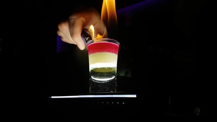 Flaming B52 Shot Cocktail On Fire in Night Club Bar