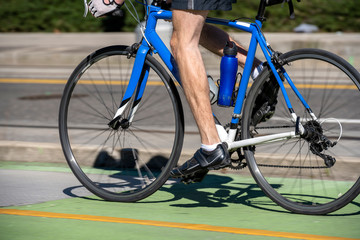 Fototapeta na wymiar Elderly bicyclist practicing road sport bike for better health