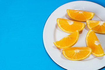 Fototapeta na wymiar Orange slices on colorful background