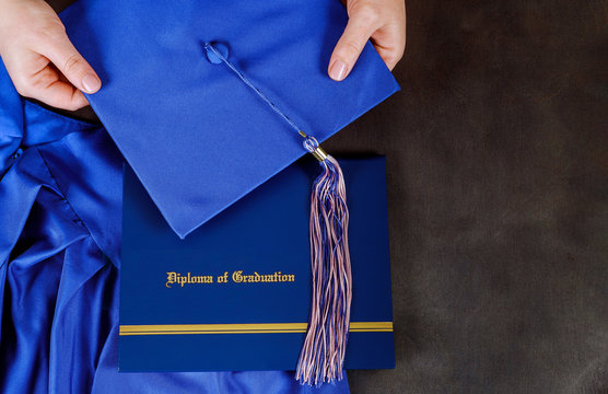 A graduation certificate diploma with graduation hat with empty space