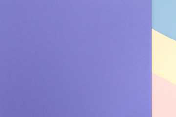 Vibrant multicolor background from cardboard of different colors. Color paper for background. Colorful abstract geometric shapes. Minimalist design for minimal background. Colorful background.