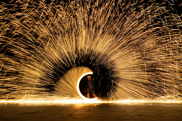 The bright spin fire sparks and fire show  in the night
