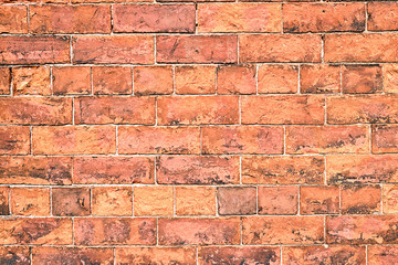 Background from an old and rugged orange brick wall