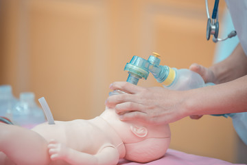 Medical students are training to save lives in the infant model.