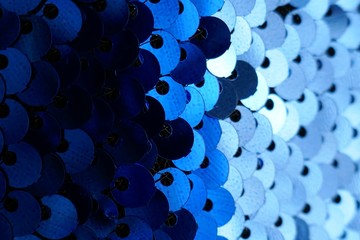 Sequins macro background. Blue Texture scales with Sequins close-up.sequins in blue tones.ridescent...