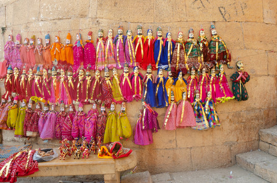 colorful puppets hanging on wall at Jaisalmer, Rajasthan, India