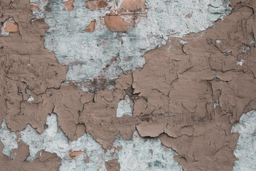 Old wall with cracks and plaster. Concrete wall brown ruined wall. Grunge texture. Cracks in the...