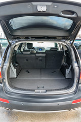 Clean, open empty trunk in the car SUV. Transformation of the seats for carrying luggage in the cabin.