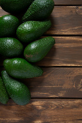avocado on dark wooden surface
