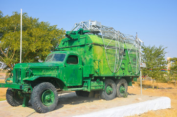 green military truck with radar