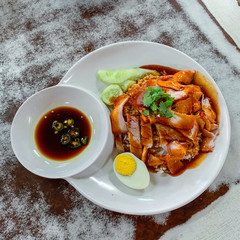 Red pork rice on the old white wooden table top