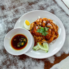 Red pork rice on the old white wooden table top