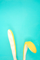Bunny ears. Easter concept. Holiday composition on blue background with copy space.