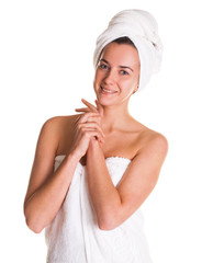 Young woman without makeup in a bath towel on her head, isolated on white