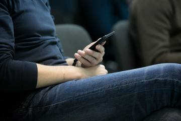 Obraz na płótnie Canvas man, student, businessman sitting with a phone