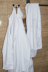 Rest in the hotel. Bathrobe in the bathroom.