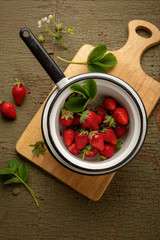 Fresh berry in vintage colander