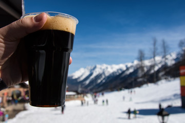 The mountains and beautiful vacation. Dark beer.