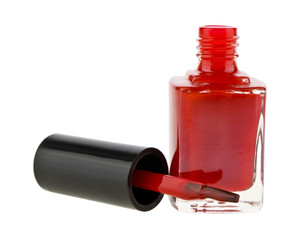 bottle with red nail polish isolated on white background close up