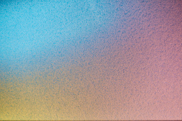 Pink yellow and blue spot of light in full blur