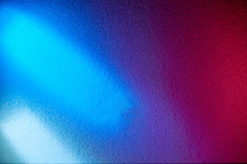 Light blue and white short rays of light on a blue and dark pink background