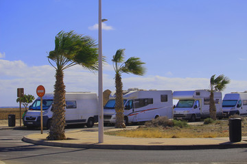 Motor homes parking along the road near the beach (El Medano, Tenerife, Canary, Islands, Spain)