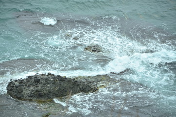 waves crashing on rocks