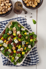 Italian salad with avocado, gorgonzola cheese.
