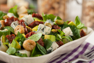 Italian salad with avocado, gorgonzola cheese.