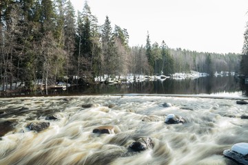 Long exposure photo. Dam and threshold on the river Jokelanjoki, Kouvola, Finland