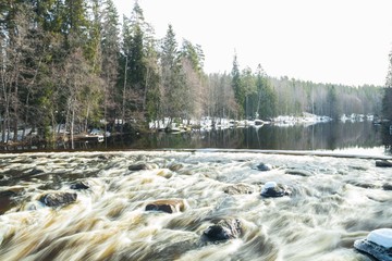 Long exposure photo. Dam and threshold on the river Jokelanjoki, Kouvola, Finland