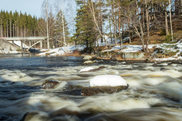 Long exposure photo. Dam and threshold on the river Jokelanjoki, Kouvola, Finland