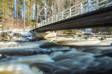 Long exposure photo. Dam and threshold on the river Jokelanjoki, Kouvola, Finland