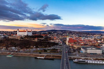 Obraz premium Bratislava, Slovakia: aerial panorama of the old city center at sunset across the Danube river
