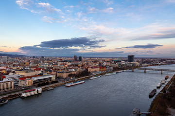 Fototapeta na wymiar Bratislava, Slovakia: aerial panorama of the Danube and the old city center at sunset across the river