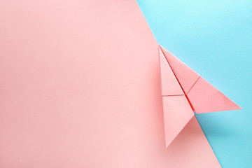 Paper plane on color background. Travel concept