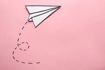 Paper plane on color background. Travel concept