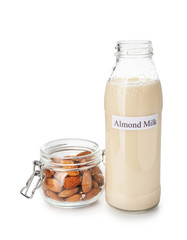 Bottle of almond milk on white background