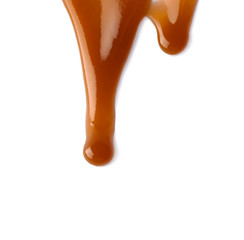 Stains of liquid caramel on white background