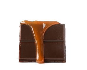 Chocolate covered with liquid caramel on white background