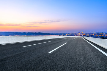 Fototapeta premium Asphalt highway passing through the city above in Hangzhou at sunset