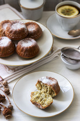 Lemon poppy biscuit muffins for tea on a light background.