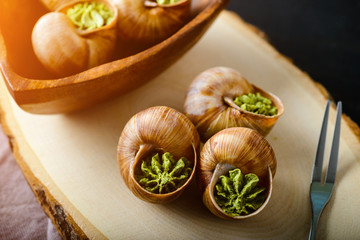 portion of Escargots de Bourgogne or Snails with herbs, view from above