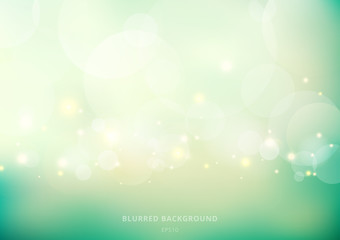 Abstract nature glowing sun light flare and bokeh with green turquoise color smooth blurred background.
