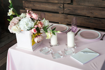 Setting the wedding table for a young couple